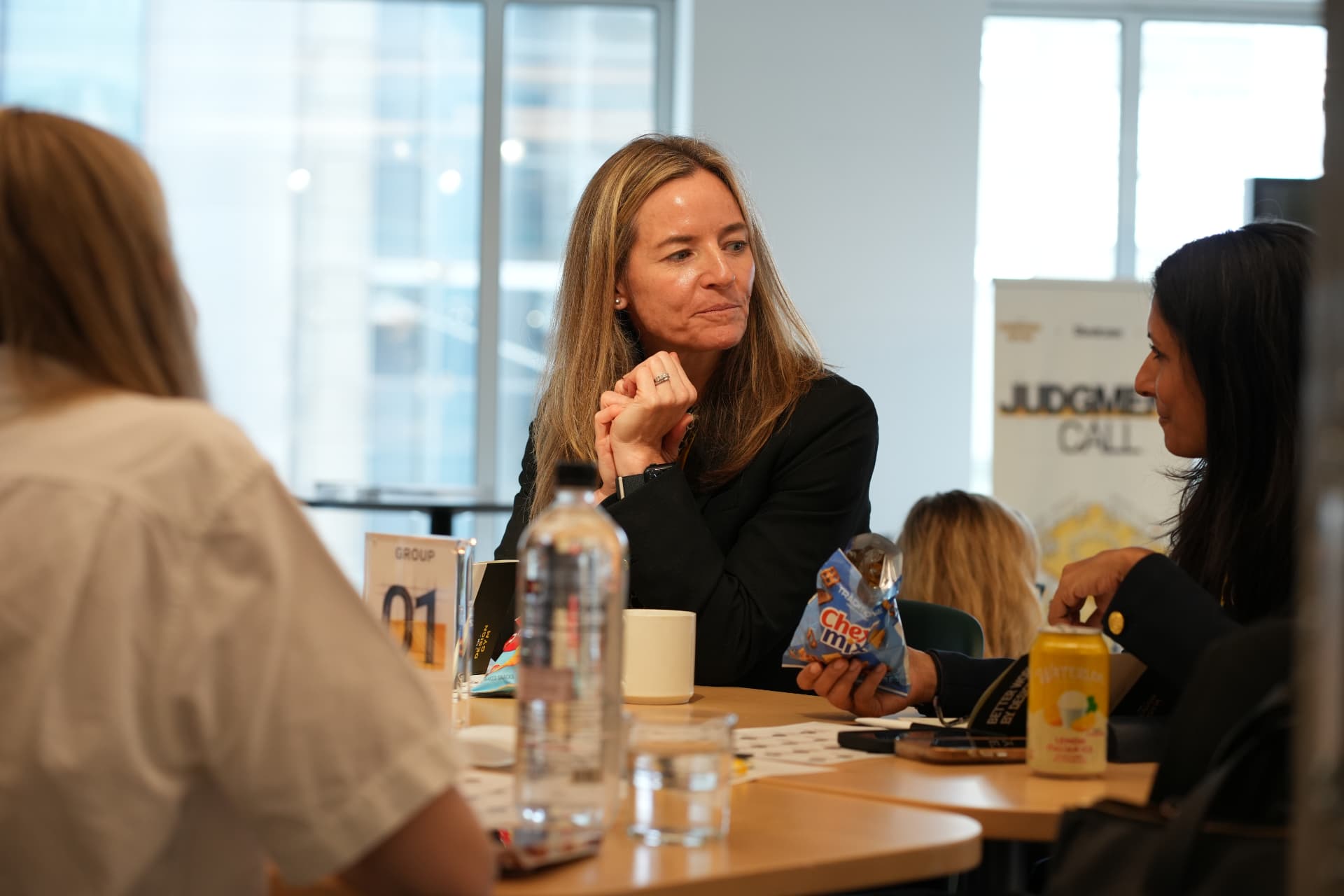 A leader listens intently during a small-group conversation